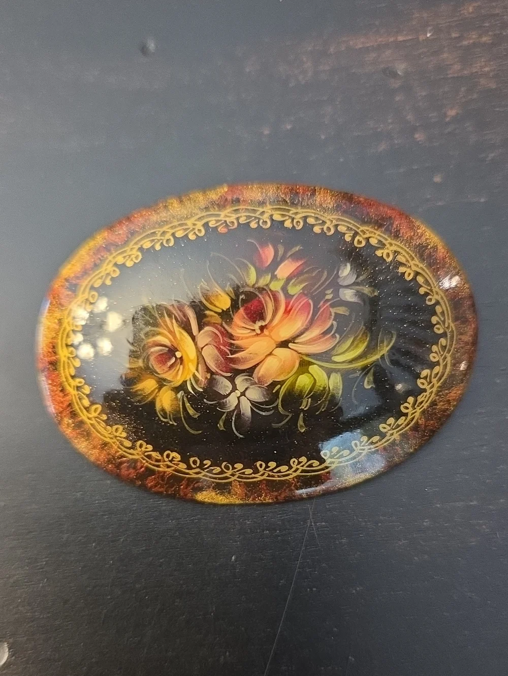 Vintage '96 Oval Black Floral Brooch with Gold Accents